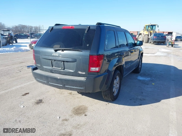2007 Jeep Grand Cherokee Laredo with VIN 1J8GS48K97C538509, listed as a IAAI auction lot 41605236 with 164,530 mi miles. Bid and sale history available at carsss.com. Image 4.