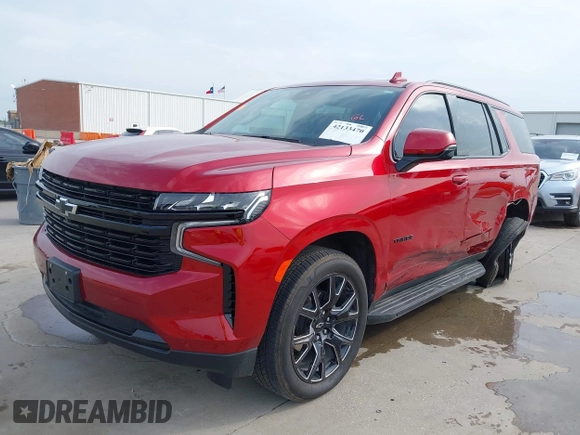 2024 Chevrolet Tahoe RST with VIN 1GNSCRKD7RR409245, listed as a IAAI auction lot 42133470 with 11,051 mi miles and . Bid and sale history available at DreamBid. Image 2.