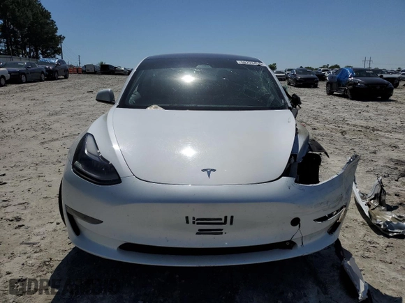 2023 Tesla Model 3 with VIN 5YJ3E1EA9PF558088, listed as a Copart auction lot 52228465 with 63,204 mi miles and Salvage title. Bid and sale history available at DreamBid. Image 5.