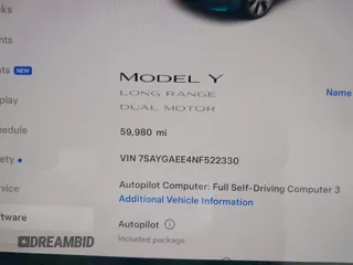 2022 Tesla Model Y Long Range with VIN 7SAYGAEE4NF522330, listed as a IAAI auction lot 42046691 with 59,980 mi miles and . Bid and sale history available at carsss.com. Image 7.