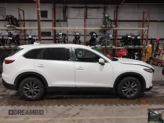 2022 Mazda CX-9 Sport z VIN JM3TCBBYXN0603653, wystawiony jako IAAI lot #42325893 z przebiegiem 57 480 mil mil oraz . Historia ofert i sprzedaży dostępna na DreamBid. Obrazek 13.