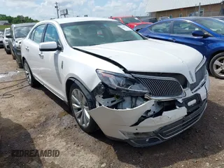 2014 Lincoln MKS with VIN 1LNHL9DK7EG601720, listed as a IAAI auction lot 42464979 with 58,163 mi miles and . Bid and sale history available at DreamBid. Image 1.