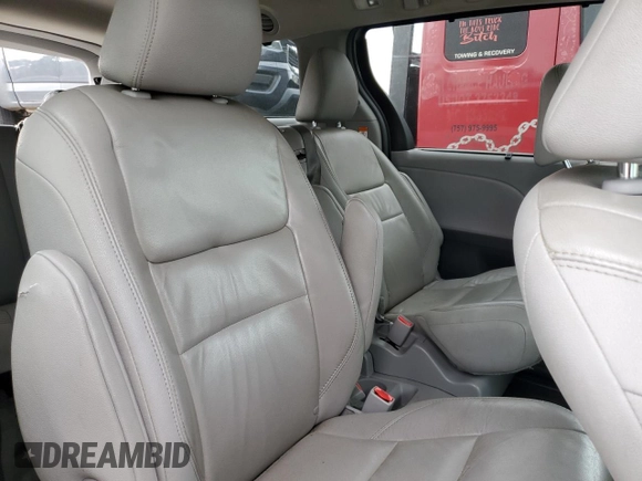 2015 Toyota Sienna XLE с VIN 5TDYK3DC7FS571431, выставлен на аукционе Copart как лот 57173595 с пробегом 305 940 миль миль и Списание • Salvage title. История ставок и продаж доступна на DreamBid. Изображение 11.