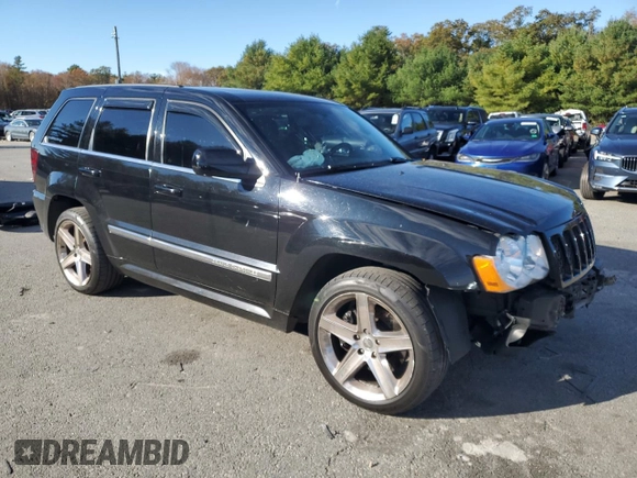 2008 Jeep Grand Cherokee SRT-8 with VIN 1J8HR78368C152318, listed as a Copart auction lot 74203604 with 157,840 mi miles and Salvage Title. Bid and sale history available at carsss.com. Image 4.