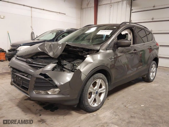 2014 Ford Escape SE with VIN 1FMCU9GX7EUA03627, listed as a IAAI auction lot 41728343 with 128,477 mi miles. Bid and sale history available at carsss.com. Image 2.