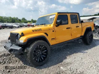 2021 Jeep Gladiator Sport S with VIN 1C6HJTAG9ML561192, listed as a Copart auction lot 61616395 with 76,399 mi miles and Salvage title. Bid and sale history available at DreamBid. Image 1.