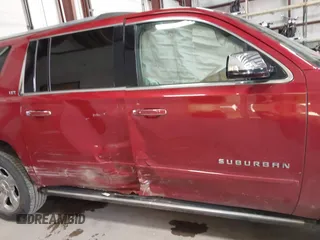 2015 Chevrolet Suburban LTZ z VIN 1GNSKKKC7FR218034, wystawiony jako IAAI lot #41884644 z przebiegiem 160 721 mil mil oraz . Historia ofert i sprzedaży dostępna na DreamBid. Obrazek 13.