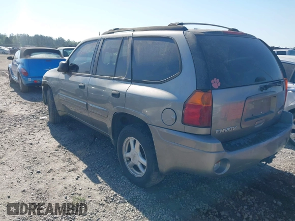 2005 GMC Envoy SLT with VIN 1GKDS13SX52175970, listed as a IAAI auction lot 42047871 with 205,432 mi miles. Bid and sale history available at carsss.com. Image 3.