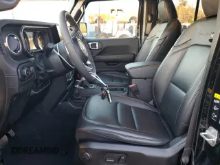 2024 Jeep Wrangler Sahara with VIN 1C4PJXENXRW118401, listed as a Copart auction lot 84731534 with 6,895 mi miles and Salvage Title. Bid and sale history available at DreamBid. Image 7.