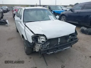 2005 Hyundai Accent GLS z VIN KMHCG45C05U595012, wystawiony jako IAAI lot #42282762 z przebiegiem 44 985 mil mil oraz . Historia ofert i sprzedaży dostępna na DreamBid. Obrazek 1.