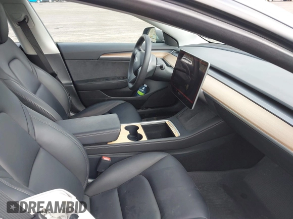 2023 Tesla Model 3 with VIN 5YJ3E1EA2PF623217, listed as a IAAI auction lot 41701413 with 21,246 mi miles and . Bid and sale history available at DreamBid. Image 5.