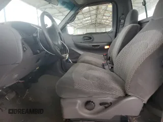 1999 Ford F-150 XL with VIN 2FTRF17L0XCB19827, listed as a Copart auction lot 85282164 with 52,103 mi miles and Salvage title. Bid and sale history available at DreamBid. Image 7.