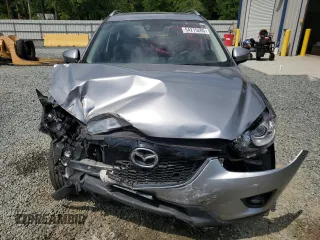 2014 Mazda CX-5 Grand Touring with VIN JM3KE4DY9E0416967, listed as a Copart auction lot 54215285 with 77,296 mi miles and Salvage Title. Bid and sale history available at DreamBid. Image 5.