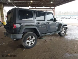 2015 Jeep Wrangler Unlimited Willys Wheeler with VIN 1C4BJWDG9FL652607, listed as a IAAI auction lot 41836193 with 166,152 mi miles. Bid and sale history available at carsss.com. Image 4.