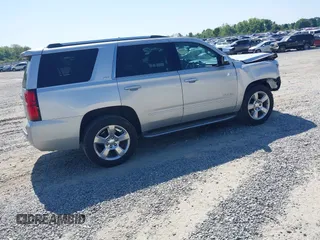2015 Chevrolet Tahoe LTZ z VIN 1GNSCCKC8FR149888, wystawiony jako IAAI lot #42049804 z przebiegiem 182 991 mil mil oraz . Historia ofert i sprzedaży dostępna na DreamBid. Obrazek 4.