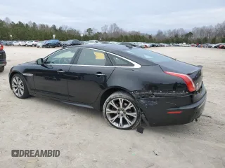 2015 Jaguar XJ with VIN SAJWA1CZ1F8V85402, listed as a Copart auction lot 86717734 with 201,249 mi miles and Salvage Title. Bid and sale history available at carsss.com. Image 2.