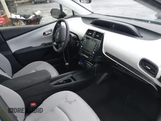 2022 Toyota Prius L Eco with VIN JTDKAMFU4N3158998, listed as a IAAI auction lot 42625041 with 43,033 mi miles and . Bid and sale history available at DreamBid. Image 5.