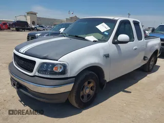1999 Ford F-150 with VIN 1FTRX07W0XKA01385, listed as a IAAI auction lot 42247809 with 147,105 mi miles and . Bid and sale history available at DreamBid. Image 2.