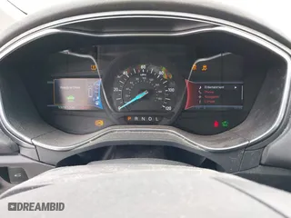 2014 Ford Fusion Titanium Hybrid with VIN 3FA6P0RU6ER115985, listed as a IAAI auction lot 41870494 with 132,321 mi miles. Bid and sale history available at carsss.com. Image 7.