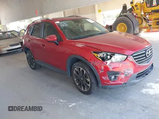 2016 Mazda CX-5 Grand Touring z VIN JM3KE2DY2G0601756, wystawiony jako IAAI lot #42146203 z przebiegiem 110 183 mil mil oraz . Historia ofert i sprzedaży dostępna na DreamBid. Obrazek 1.