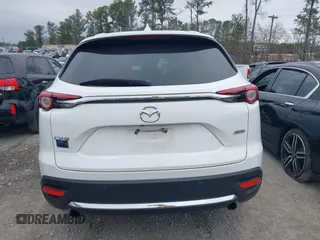 2016 Mazda CX-9 Grand Touring with VIN JM3TCADY0G0113779, listed as a IAAI auction lot 41466750 with 58,035 mi miles and . Bid and sale history available at DreamBid. Image 16.