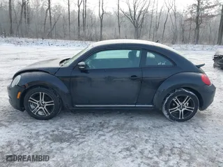 2012 Volkswagen Beetle 2.5L PZEV with VIN 3VWJP7AT8CM619137, listed as a IAAI auction lot 41195954 with 157,741 mi miles. Bid and sale history available at carsss.com. Image 14.