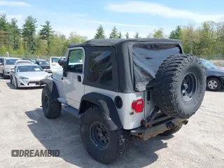 2003 Jeep Wrangler Sport z VIN 1J4FA49S73P302278, wystawiony jako IAAI lot #42219582 z przebiegiem 129 089 mil mil oraz . Historia ofert i sprzedaży dostępna na DreamBid. Obrazek 3.