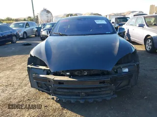 2015 Tesla Model S 85D with VIN 5YJSA1E28FF110066, listed as a IAAI auction lot 40672973 with 100,157 mi miles. Bid and sale history available at carsss.com. Image 13.