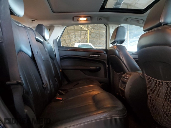 2012 Cadillac SRX Premium Collection z VIN 3GYFNFE30CS599863, wystawiony jako Copart lot #61249995 z przebiegiem 144 740 mil mil oraz Czysty tytuł • Clean title. Historia ofert i sprzedaży dostępna na DreamBid. Obrazek 10.