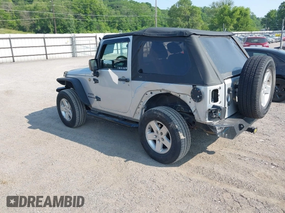 2012 Jeep Wrangler Sport z VIN 1C4AJWAG9CL255278, wystawiony jako IAAI lot #42469091 z przebiegiem 140 480 mil mil oraz . Historia ofert i sprzedaży dostępna na DreamBid. Obrazek 3.