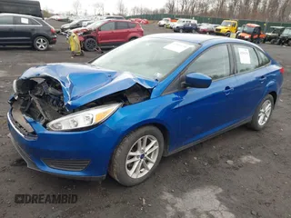 2018 Ford Focus SE z VIN 1FADP3F23JL200674, wystawiony jako IAAI lot #42009238 z przebiegiem 78 007 mil mil oraz . Historia ofert i sprzedaży dostępna na DreamBid. Obrazek 17.
