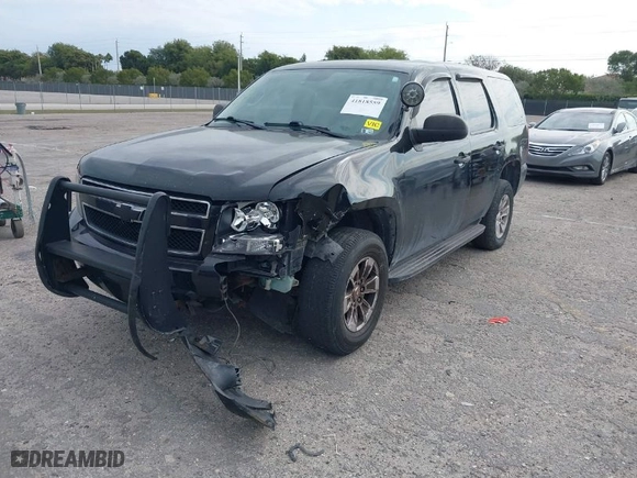 2010 Chevrolet Tahoe LS with VIN 1GNUKAE06AR252687, listed as a IAAI auction lot 41818559 with 158,877 mi miles. Bid and sale history available at carsss.com. Image 2.