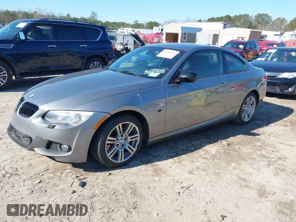 2012 BMW 3 Series 335i xDrive with VIN WBAKF9C5XCE620684, listed as a IAAI auction lot 41341828 with 154,809 mi miles. Bid and sale history available at carsss.com. Image 2.