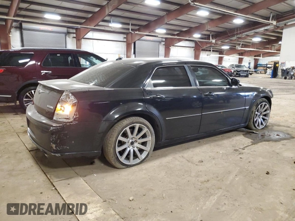 2006 Chrysler 300 C SRT8 with VIN 2C3LA73WX6H106631, listed as a Copart auction lot 50715715 with 104,990 mi miles and Clean Title. Bid and sale history available at carsss.com. Image 3.