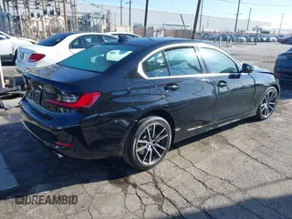 2021 BMW 3 Series 330i with VIN 3MW5R1J00M8B85692, listed as a IAAI auction lot 41824283 with 21,040 mi miles. Bid and sale history available at carsss.com. Image 4.