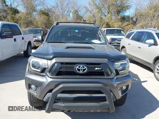 2014 Toyota Tacoma PreRunner with VIN 5TFJU4GN3EX057731, listed as a IAAI auction lot 41703750 with 110,321 mi miles. Bid and sale history available at carsss.com. Image 12.