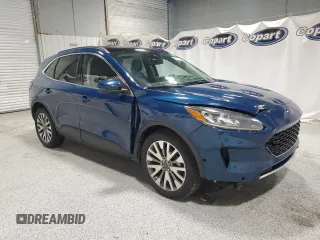 2020 Ford Escape Titanium z VIN 1FMCU9J98LUA93393, wystawiony jako Copart lot #65366925 z przebiegiem 74 750 mil mil oraz Czysty tytuł • Clean title. Historia ofert i sprzedaży dostępna na DreamBid. Obrazek 4.