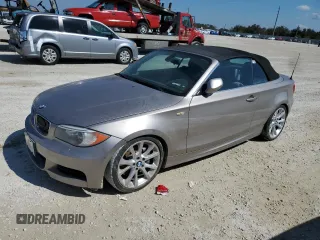 2013 BMW 1 Series 135i with VIN WBAUN7C52DVM26880, listed as a Copart auction lot 77858684 with 0 mi miles and Salvage Title. Bid and sale history available at carsss.com. Image 1.