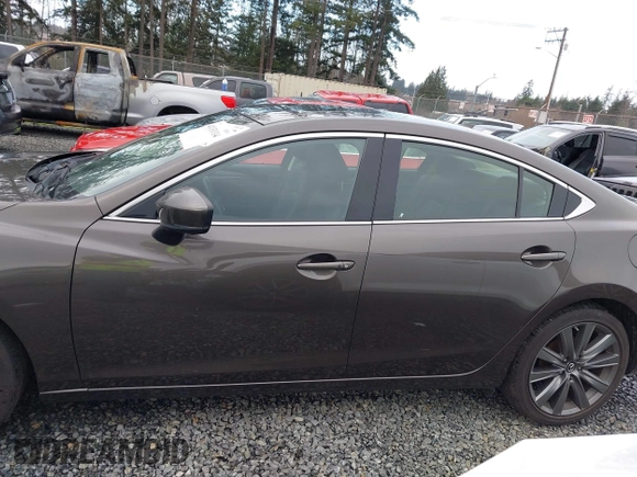 2018 Mazda 6 Grand Touring with VIN JM1GL1TYXJ1301545, listed as a IAAI auction lot 41131114 with 34,089 mi miles and . Bid and sale history available at DreamBid. Image 14.