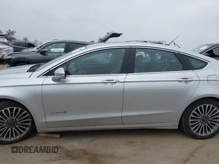 2017 Ford Fusion Hybrid Titanium z VIN 3FA6P0RU7HR300311, wystawiony jako IAAI lot #42045664 z przebiegiem 136 231 mil mil oraz . Historia ofert i sprzedaży dostępna na DreamBid. Obrazek 14.