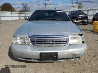 2003 Ford Crown Victoria LX z VIN 2FAFP74W03X122995, wystawiony jako Copart lot #55774415 z przebiegiem 234 485 mil mil oraz Czysty tytuł • Clean title. Historia ofert i sprzedaży dostępna na DreamBid. Obrazek 5.