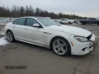 2015 BMW 6 Series 640i xDrive z VIN WBA6B8C55FD452972, wystawiony jako Copart lot #44559495 z przebiegiem 114 358 mil mil oraz Szkoda całkowita • Salvage title. Historia ofert i sprzedaży dostępna na DreamBid. Obrazek 4.
