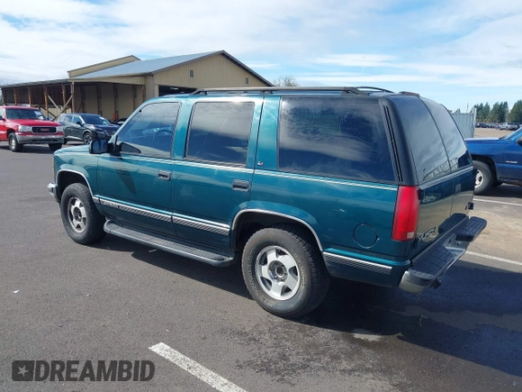 1999 GMC Yukon with VIN 1GKEK13R3XJ717999, listed as a IAAI auction lot 41870187 with 179,855 mi miles. Bid and sale history available at carsss.com. Image 3.