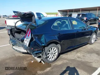 2020 Toyota Camry LE with VIN 4T1L11AKXLU999381, listed as a IAAI auction lot 41782771 with 58,526 mi miles. Bid and sale history available at carsss.com. Image 4.