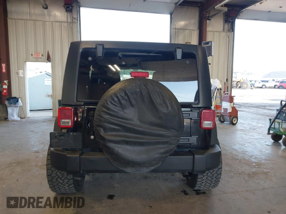 2012 Jeep Wrangler Unlimited Sport with VIN 1C4BJWDG8CL246829, listed as a IAAI auction lot 41816197 with 198,502 mi miles. Bid and sale history available at carsss.com. Image 17.