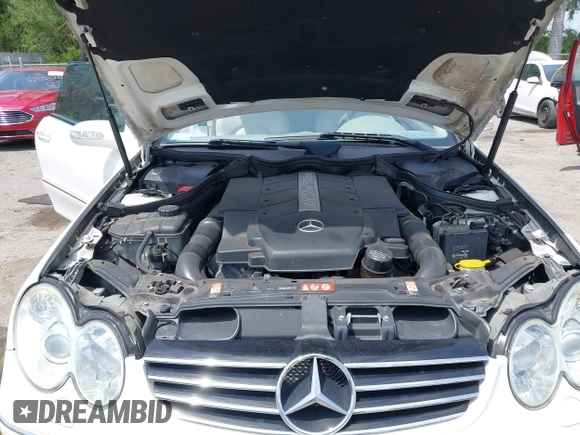 2005 Mercedes-Benz CLK 5.0L with VIN WDBTK75J55F123328, listed as a IAAI auction lot 42082590 with 58,969 mi miles. Bid and sale history available at carsss.com. Image 10.