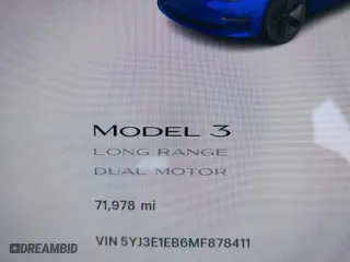 2021 Tesla Model 3 Long Range with VIN 5YJ3E1EB6MF878411, listed as a IAAI auction lot 41986947 with 71,978 mi miles. Bid and sale history available at carsss.com. Image 7.