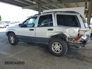 2003 Jeep Grand Cherokee Laredo with VIN 1J4GW48S23C617830, listed as a Copart auction lot 57481565 with 122,745 mi miles and Salvage title. Bid and sale history available at DreamBid. Image 2.