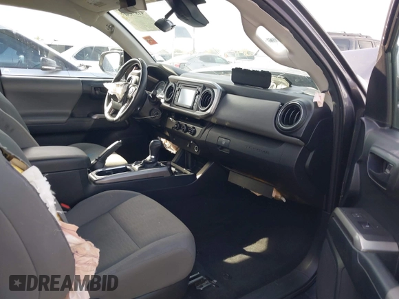 2018 Toyota Tacoma SR with VIN 5TFRX5GN8JX116802, listed as a IAAI auction lot 41879503 with 86,448 mi miles and . Bid and sale history available at DreamBid. Image 5.