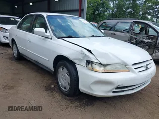 2002 Honda Accord LX z VIN 1HGCG164X2A028072, wystawiony jako IAAI lot #42719614 z przebiegiem 89 452 mil mil oraz . Historia ofert i sprzedaży dostępna na DreamBid. Obrazek 1.